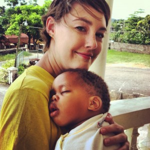 Sarah with a baby at an orphanage in Jamaica.