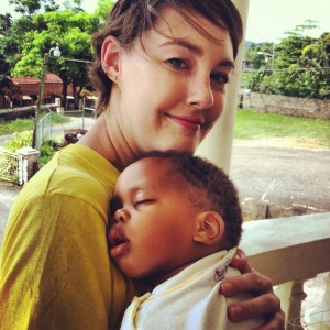 Sarah with a baby at an orphanage in Jamaica.