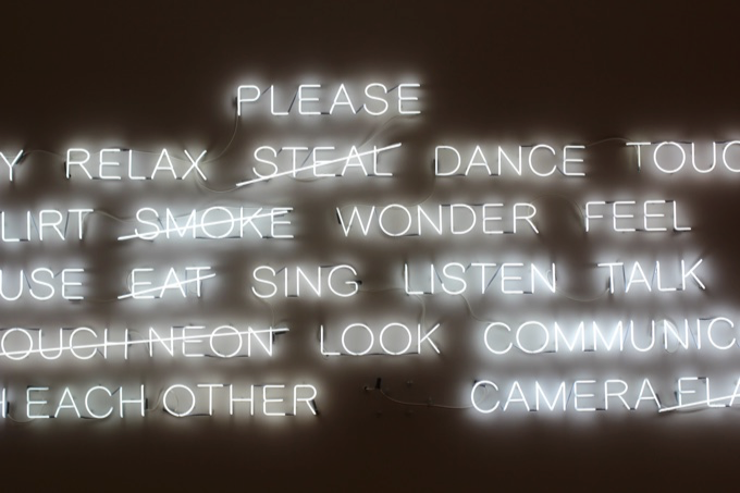 Image of multiple words in neon lighting