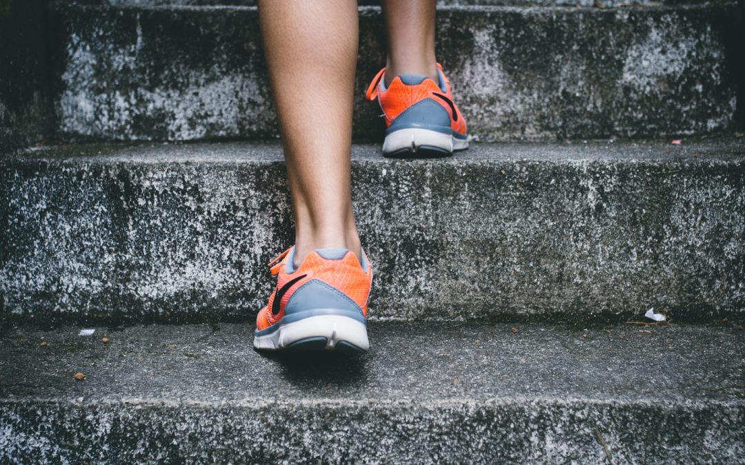 Image of feet running up steps