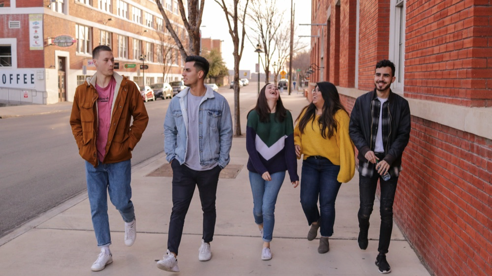 Image of a group of friends talking and laughing
