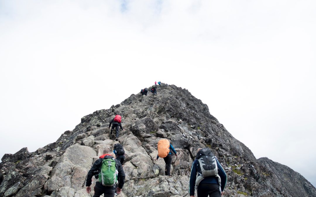 Image of people climbing a mountain
