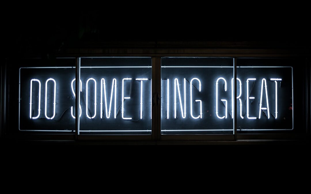 Neon sign that says, "Do Something Great"